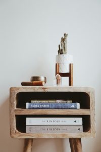 There is a stand with books